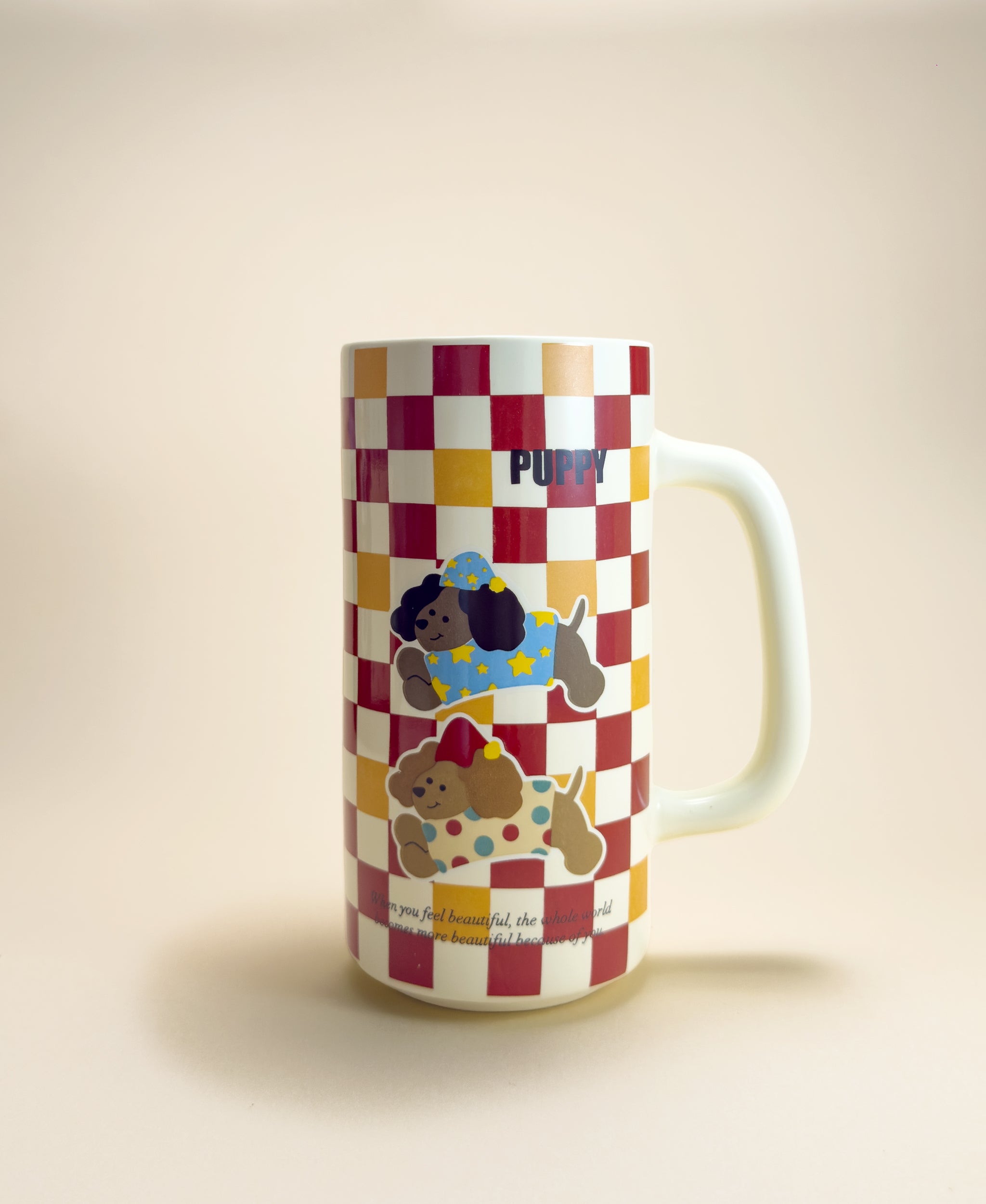 Checkered mug with cartoon dog characters on a beige background